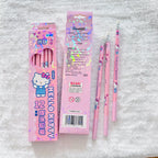 A pink Hello Kitty 12-pack pencil set with its packaging. And displaying three individual pencils decorated with Hello Kitty illustrations.