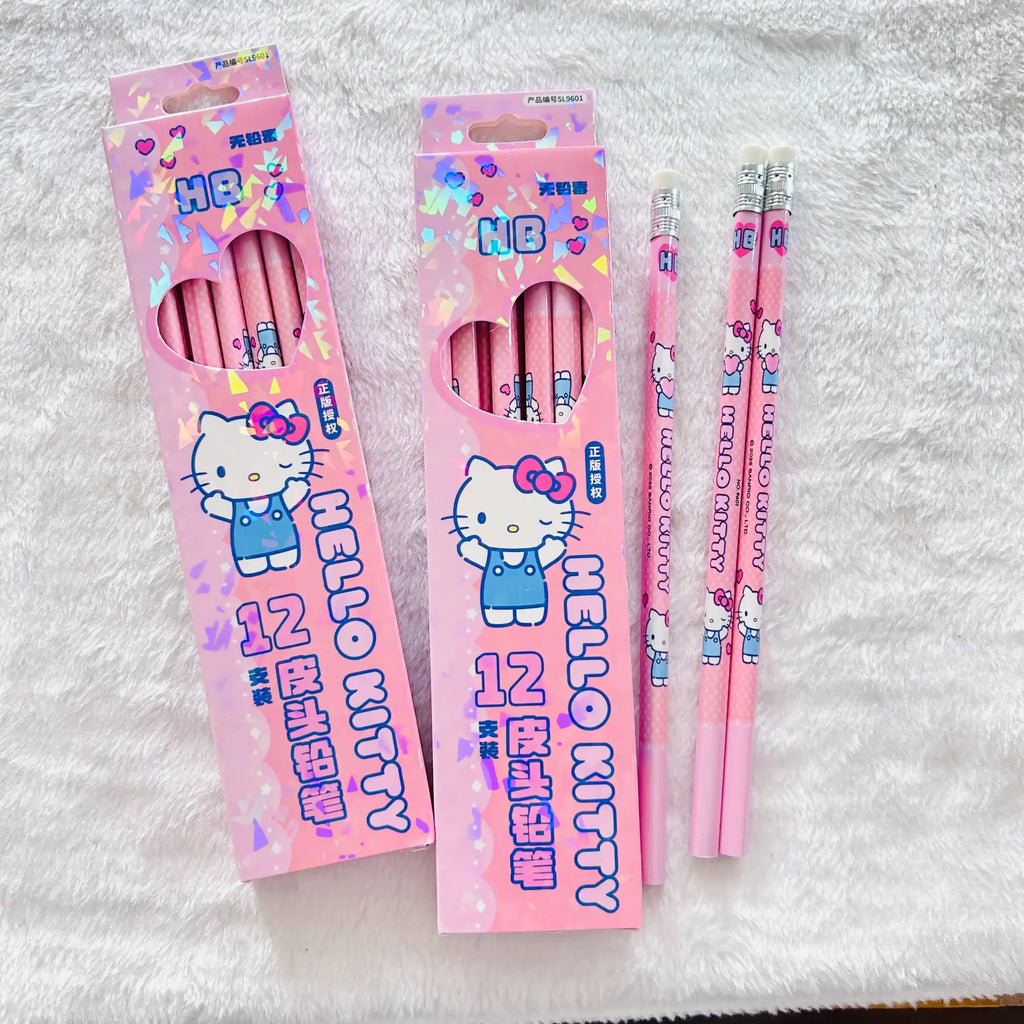 Two pink Hello Kitty pencil boxes with three matching pink pencils displayed on a white textured fabric background.  