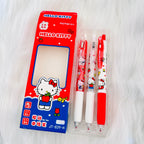 Hello Kitty themed Joytop pen set with its retail packaging, displayed on a white faux fur background. The set includes a red and blue box with a clear window showing three pens inside a clear plastic case.