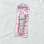 Hello Kitty 0.5mm retractable pen set in pink blister packaging, featuring a pink pen, a pastel blue and pink eraser, and a purple eraser cover on a white textured fabric background.