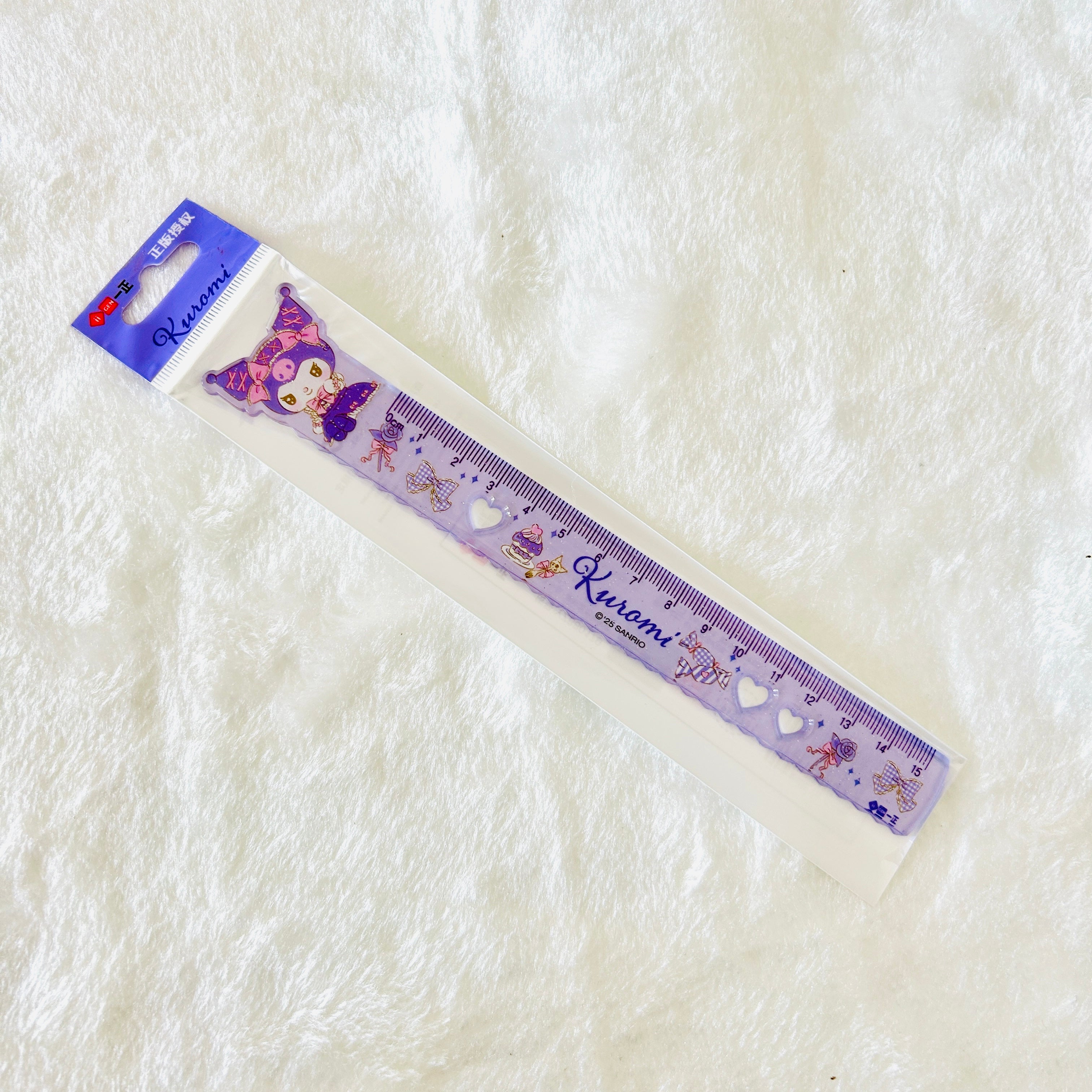 A Kuromi-themed purple color plastic ruler in its original retail packaging, with the iconic logo of Kuromi. Package shows the brand name of iiGen.  
