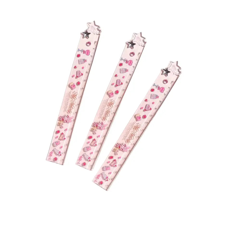Three My Melody rulers with a whimsical pattern of hearts, stars, and small illustrations.