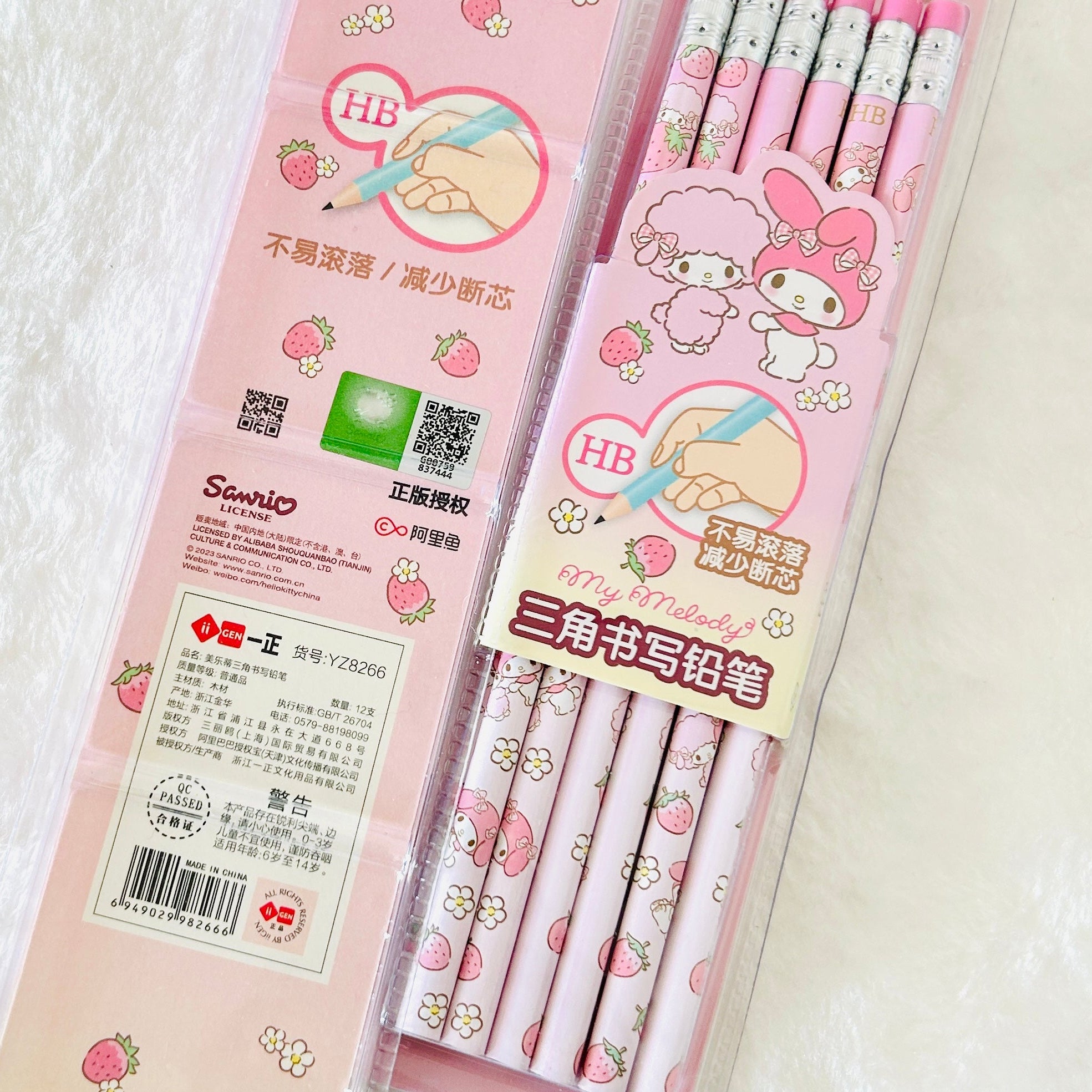 Sanrio My Melody HB gel pencil set in a pink plastic case, featuring strawberry and character illustrations on a white textured background.