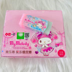 A pink and green My Melody eraser placed on it's package box with QR code. 