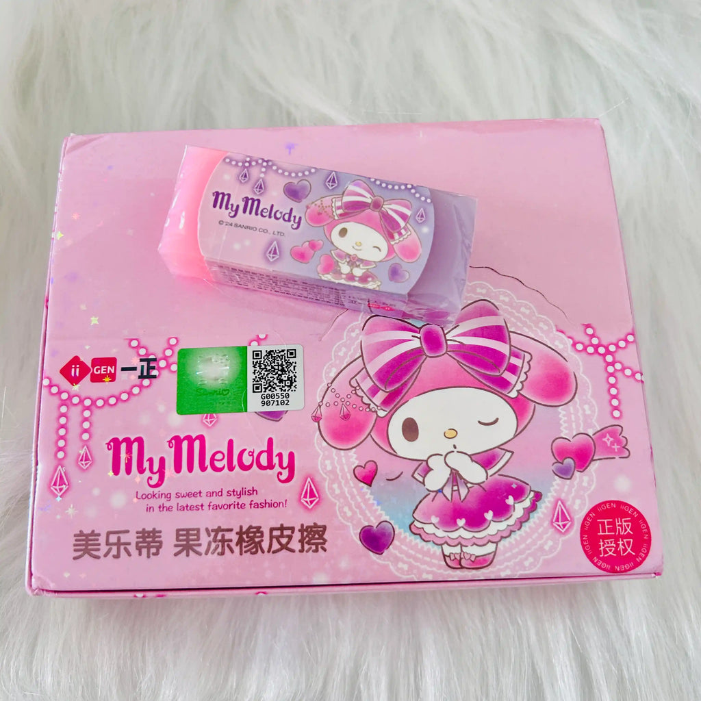 A pink My Melody eraser placed on it's package box with QR code. 