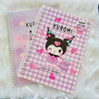 A Kuromi-themed spiral notebook with a pink and white gingham cover, featuring a Kuromi character illustration.