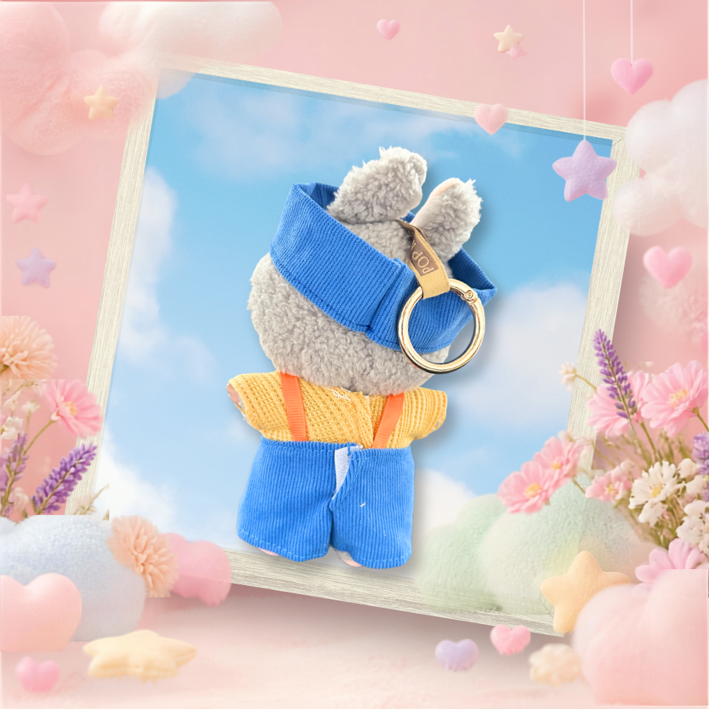 A back view Labubu wearing a clothing set of blue corduroy dungarees and colourblock cap