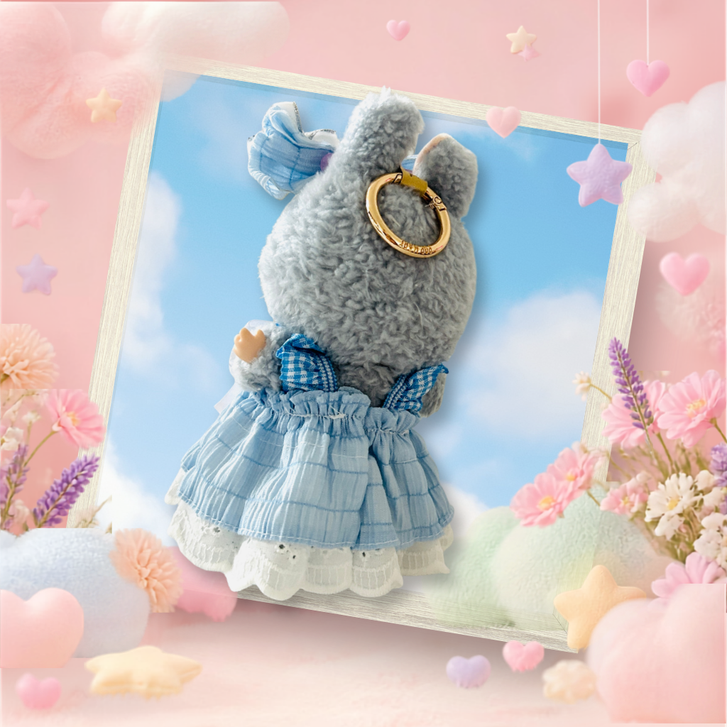 The front view of the clothing set that include baby blue ribbon dress and oversized headband bow.