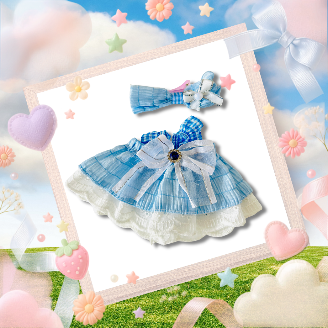 A Labubu dress set clothing top view, a baby blue and white dress with ruffle and matching headband. 