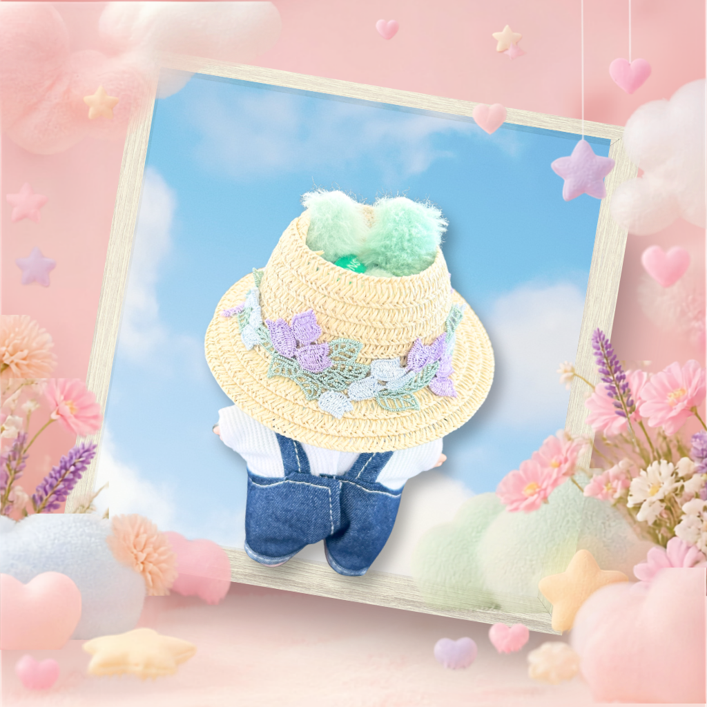 The front view of the clothing set that include indigo denim overalls and floral straw sun hat