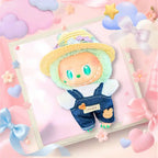 The front view of the clothing set that include indigo denim overalls and floral straw sun hat.