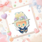 The front view of Labubu wearing the indigo denim overalls and floral straw sun hat.