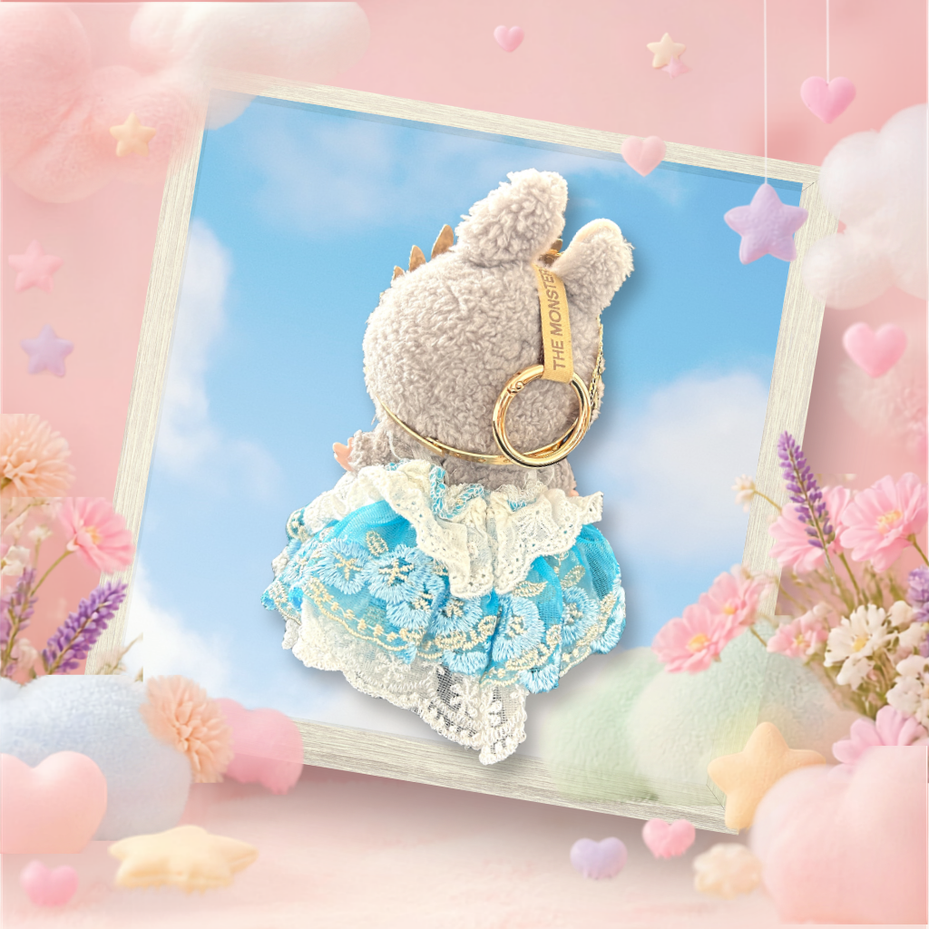 The front view of the clothing set that include blue lace coquette ballgown with golden crown