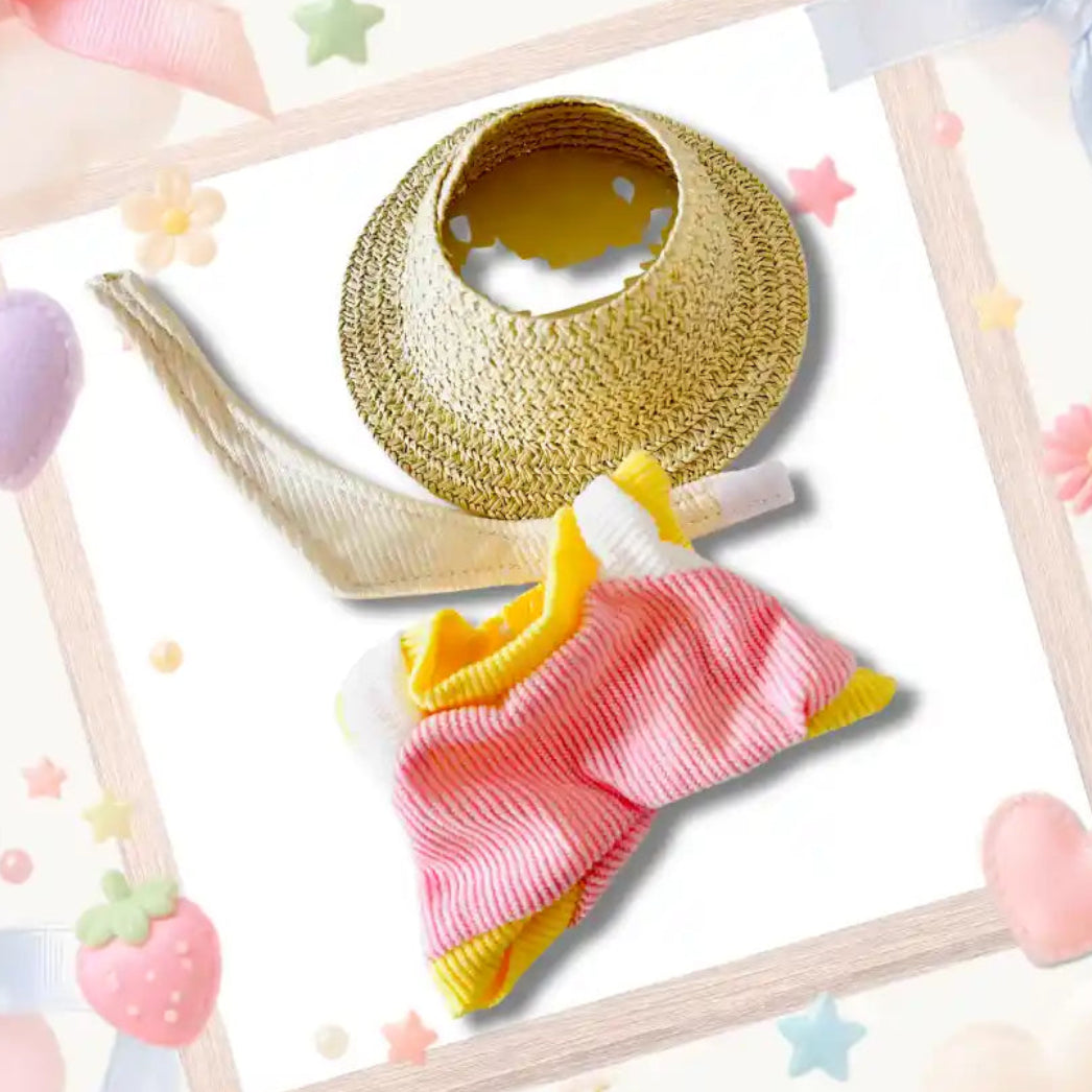 Back view of a pink and yellow doll jumpsuit with a woven sun hat.