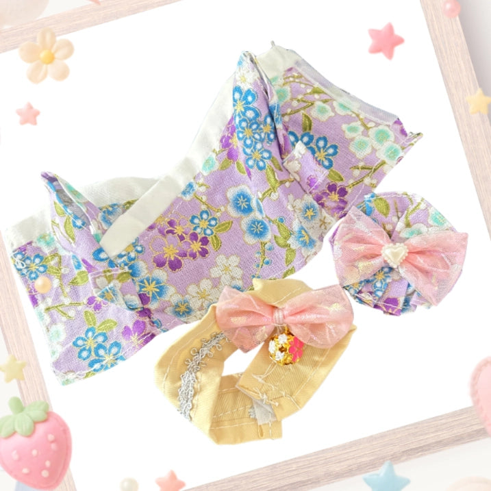 The front view of the clothing set that include purple floral kimono and tulle hairpiece.
