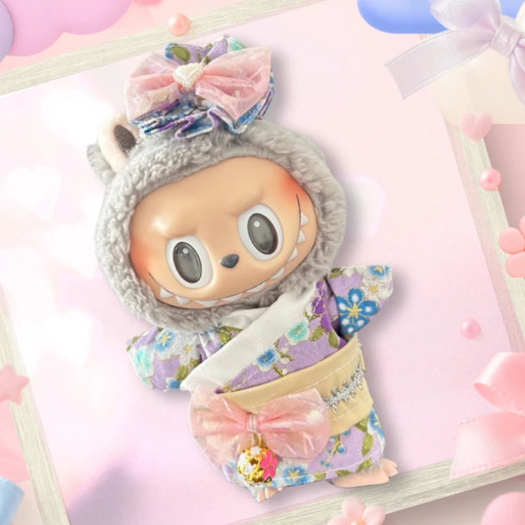 A front view of a Labubu doll wearing a pastel floral kimono with pink bows.