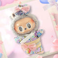 A front view of a Labubu doll wearing a pastel floral kimono with pink bows.
