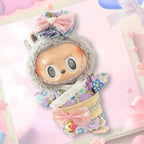 A front view of a Labubu doll wearing a pastel floral kimono with pink bows.