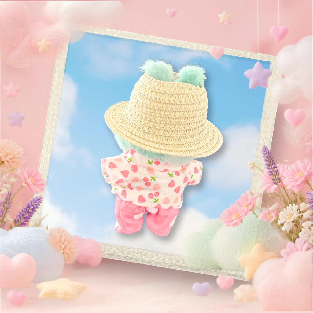The back view of the clothing set that include strawberry shirt, trousers, and straw hat