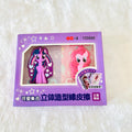 A purple retail box containing two My Little Pony character rubber eraser. The box features a clear window displaying the purple Twilight Sparkle and pink Pinky Pie erasers.