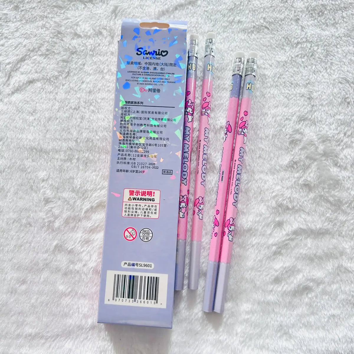 Three pink and silver Starion brand mechanical pencils with cartoon graphics are displayed next to their light purple packaging box.