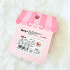 Sanrio rolling rubber accessory packaging card, featuring a pink and white striped awning design with product details and barcodes.