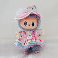A Labubu plush doll wearing a pastel pink, blue, and cream ruffled dress with star prints.