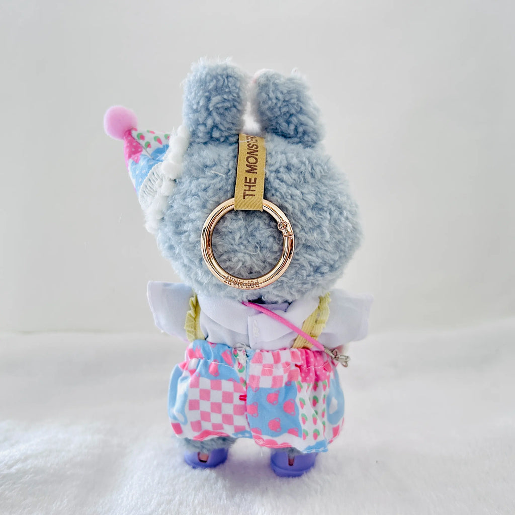 A back view Labubu wearing a clothing set of blue checkered overall dress and party cone hat
